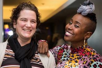 Two women pose for a photo.