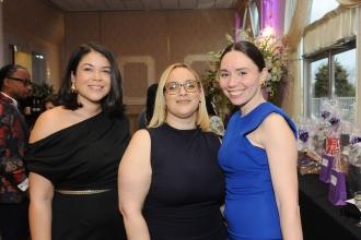 Three honorees pose for a photo at the 2025 UFT District 11 Scholarship Dinner