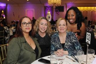Members from PS 153 in the Bronx take a group photo during the 2025 UFT District 11 Scholarship Dinner