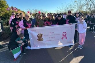 Members from PS 19 on Staten Island and their family members march to show their solidarity and their school pride at a breast cancer awareness walk on Oct. 27.