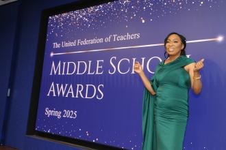An award winner smiles on stage during the inaugural UFT Middle School Awards Night on May 15, 2025 at UFT headquarters. 