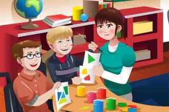 A clip art graphic of three individuals working together seated at a table
